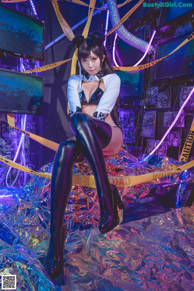 A woman sitting on top of a pile of tin foil.